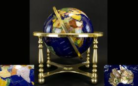 Decorative Gemstone Globe Gilt framed Globe inlaid with various semi precious stones and gold tone
