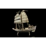A Miniature Silver Sailing Ship Figure Small and detailed silver model in the form of a twin sail