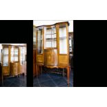 An Edwardian Bow Fronted Display Vitrine Impressive Display Cabinet with central convex cupboard