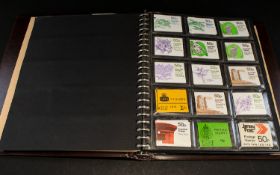 Brown Multi Ring Stamp Album packed with stamp booklets, mostly decimal GB, face value over £150.