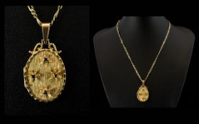 Ladies Attractive 9ct Gold Oval Shaped Hinged Locket Attached to a 9ct Gold Fancy Chain.