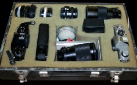 Canon A-1 35mm Camera Along with Canon TX 35mm Camera, various lenses, flash cable release etc.