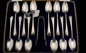 1920's Boxed - Delux Set of 12 Silver Teaspoons with Matching Pair of Silver Sugar Nips.