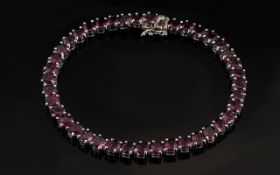 Garnet Tennis Bracelet, oval cuts of the rich violet hued red garnet, rhodolite garnet,