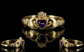 9ct Gold Attractive Claddagh Design Dress Ring set with central heart shaped amethyst held between