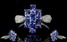 Tanzanite Cluster 9ct White Gold Ring with natural white zircon accent shoulders,