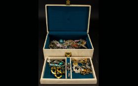 A Leatherette Jewellery Box Containing A variety Of Costume Jewellery To include brooches,