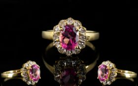 18ct Gold Diamond Dress Ring Set with central pink Sapphire gemstone,