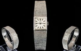 Ladies 9ct White Gold Omega Wristwatch Square silvered dial, baton numerals, manual wind,