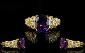 Amethyst and White Topaz Ring, an oval cut amethyst of 3.