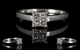 18ct White Gold Contemporary Diamond Set Dress Ring the four square cut diamonds of good colour and