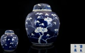 Antique Chinese Ginger Jar And Cover Blue and white with prunus design throughout,