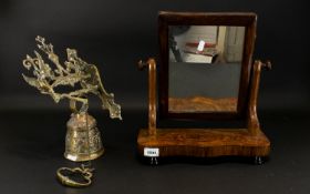 A Walnut Toilette Mirror of typical form, swivel top, shaped base. Together with a Dutch brass