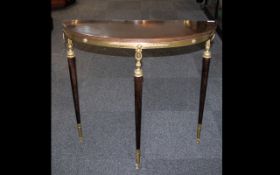 A Mid 20th Century Console Table Ormolu mounts, turned supports, height 32, 33 x 12 inches in depth.