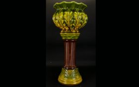 A Bretby Majolica Jardiniere, Art Nouveau foliate design jardiniere in green and chartreuse glaze,