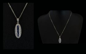 18ct White Gold Oval Shaped Diamond and Sapphire Pendant Drop on Attached 18ct White Gold Chain,