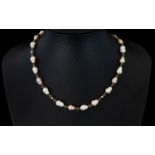 Fresh Water Pearl Necklace Silver gilt chain and clasp, length 16 inches.