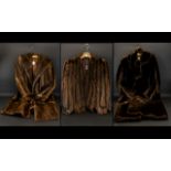 A Collection of Three Fur Coats, to include: Golden Brown Mink Evening Cape, fully lined.