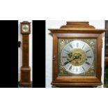 A Westminster Chime Granddaughter Clock Of typical form with ribbon inlay banding to case and brass