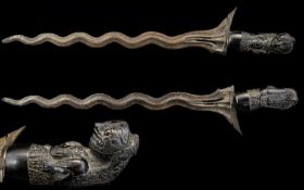 Indonesian 19th Century Long Bladed Kris Dagger with Hand Carved Figural Handle Damascus Steel