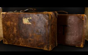 Two Vintage Travelcases Large tan leather case of traditional construct with aged patina,