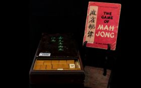 A Vintage Mah Jong Set Housed in wooden case with original tiles, markers and instruction book.