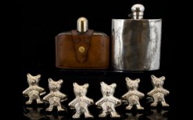 A Collection of Six White Metal Napkin Rings In The Form Of Standing Teddy Bears.