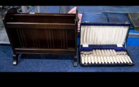 A Mahogany Magazine Rack Of typical form with lion head mask handles. Together with a set of bone