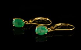 Emerald Pair of Drop Earrings, oval cut emerald solitaires, of good colour, totalling 1.