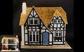 Dolls House In Tudor Style - circa early to mid 20th Century, height 21 Inches, width 25 Inches