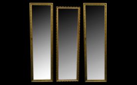 A Matching Pair Of Rectangular Bevelled Glass Mirrors, each in gilt frames Overall size including