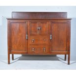 Edwardian mahogany sideboard, raised back, fitted with four doors and two drawers, width 142cm.