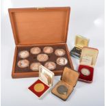 A cased set of nine silver medals issued by The Birmingham Mint "Queens of the British Isles" each