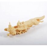 Continental carved ivory group of a fox chasing a cockerel, 18cm long.