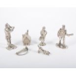 Four figural pewter street musicians and their dog,