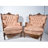 Pair of early 20th Century French carved and stained beechwood bergeres,