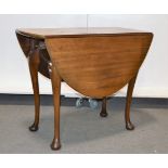 Edwardian mahogany table, oval top with two fall leaves, cabriole legs, pad feet,