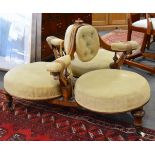 Victorian walnut conversation seat, buttoned and padded dralon, carved and scrolled frame,