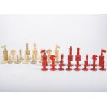 A bone chess set natural and stained red, the King and Queen 10cm high, the pawns 4.