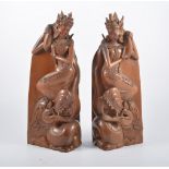 Pair of Tibetan hardwood carved figural bookends, 36cm.