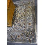 Persian pattern carpet, lozenge medallion on a pale ground, broad border, 313 x 198cm.