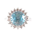 A blue topaz and diamond cluster ring,