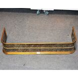 Pierced brass fender, length 94cm, depth 31cm, height 18cm.