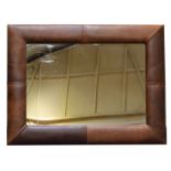 Contemporary leather framed wall mirror, brown stitched leather frame,