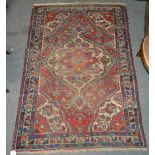 Three rugs, one with large medallions joined by a pole on a dark ground with floral borders,