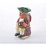 Yorkshire type red-faced Toby jug, Mr Toby seated, holding a jug of ale,