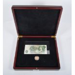 Full Sovereign Elizabeth II 1979 and a £1 note in a presentation case by The London Mint Office