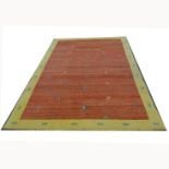 Rug, orange with yellow border, approx 310 x 210cm.