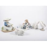 Lladro group of a sleeping boy with puppies, No.1535, 12cm; another, girl with lambs, No.