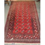 Tekke style carpet, three rows of twelve guls, enclosed by multiple borders, 264 x 153cm.